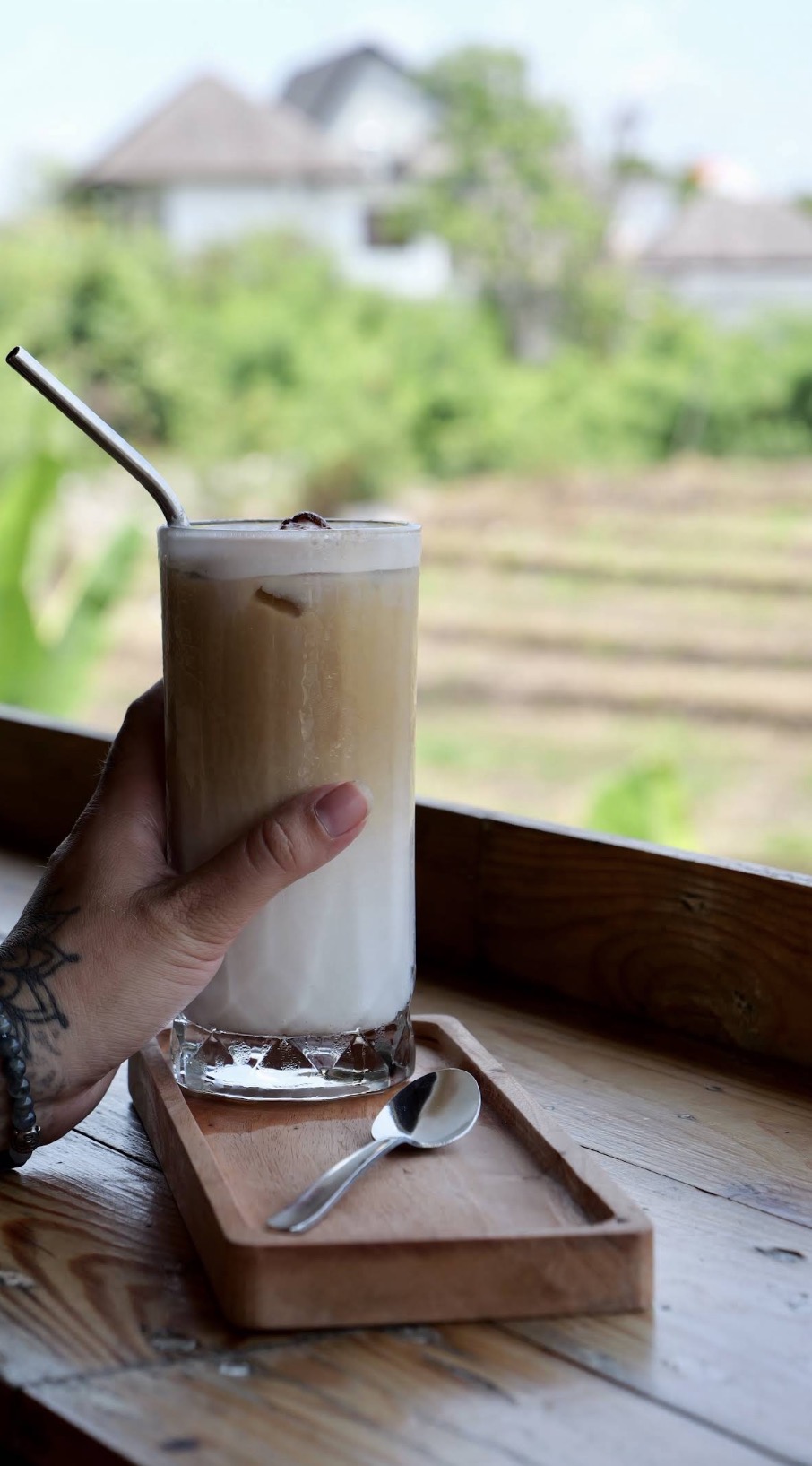 Rooftop café at Sepeda Hostel with rice field views