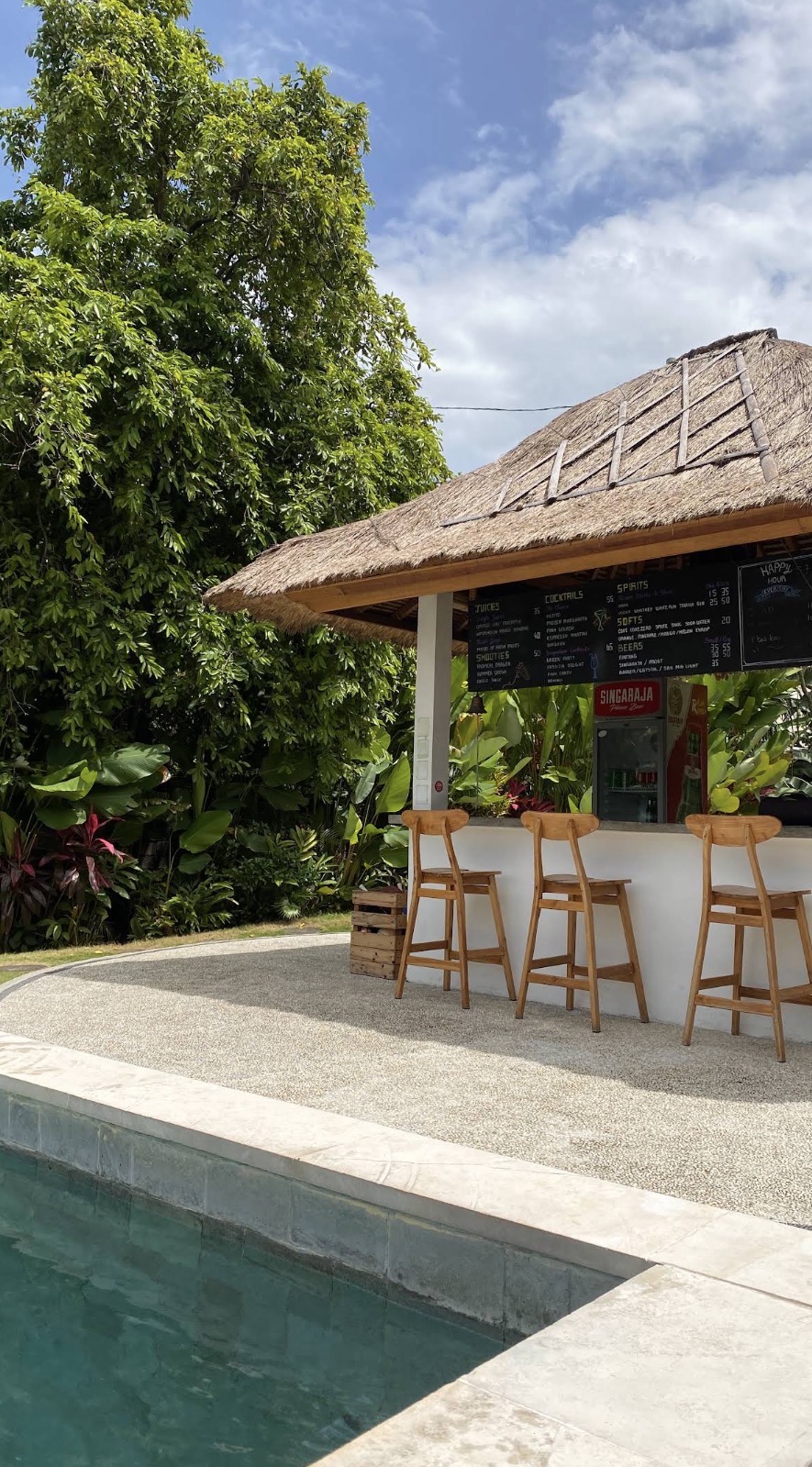Bar by the pool at Sepeda Hostel